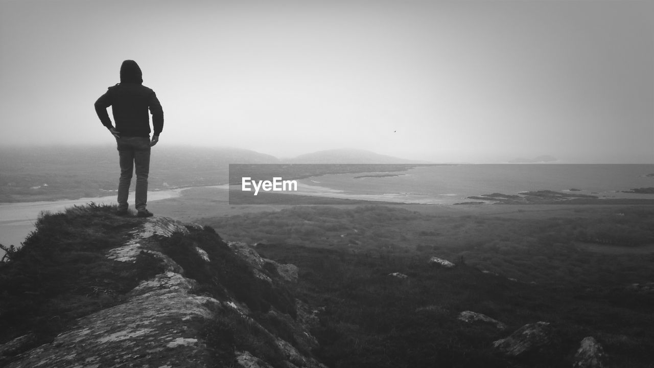 Man standing on top of mountain