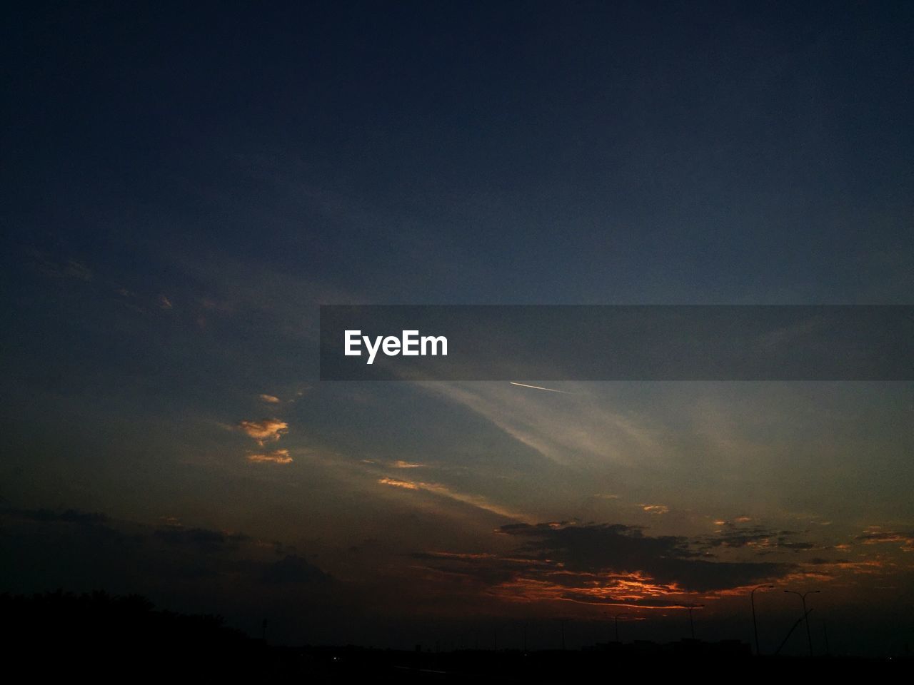 SCENIC VIEW OF DRAMATIC SKY DURING SUNSET