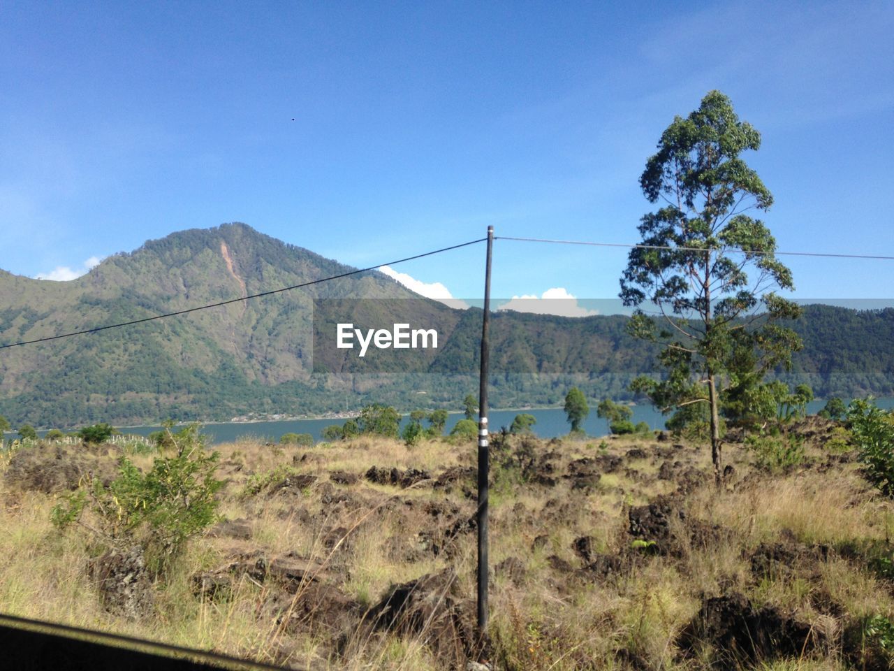 Countryside landscape against mountain range