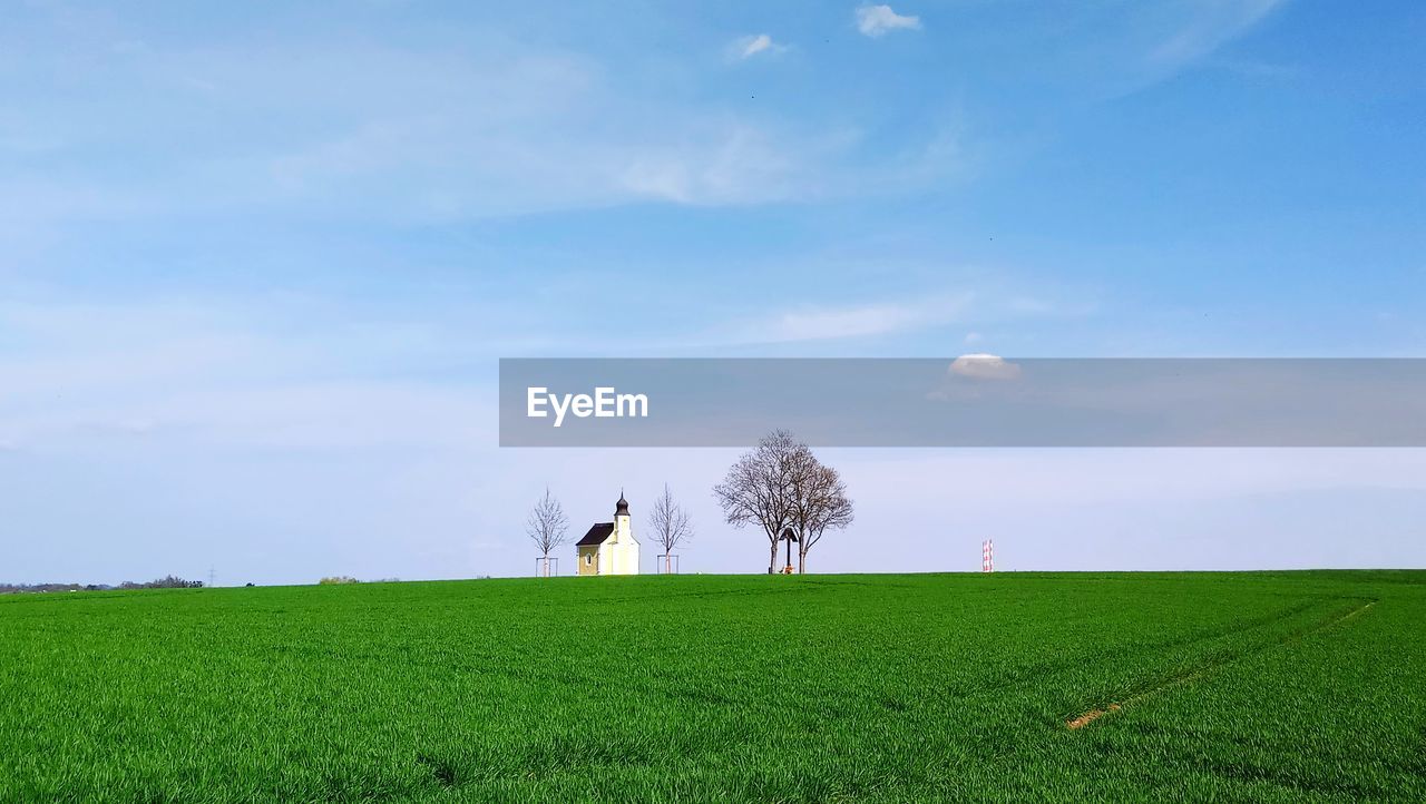 House on field against sky