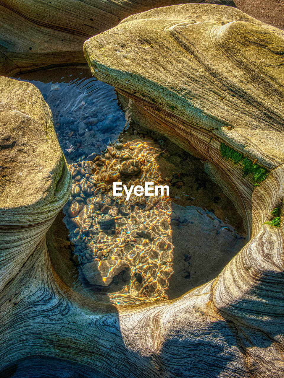 rock, no people, nature, day, land, high angle view, geology, sea, water, beauty in nature, pattern, outdoors, wood, landscape, non-urban scene, scenics - nature, sunlight, terrain, rock formation, tranquility, coast, environment, full frame, travel destinations