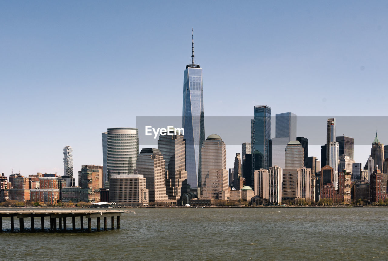 Modern buildings in city against clear sky