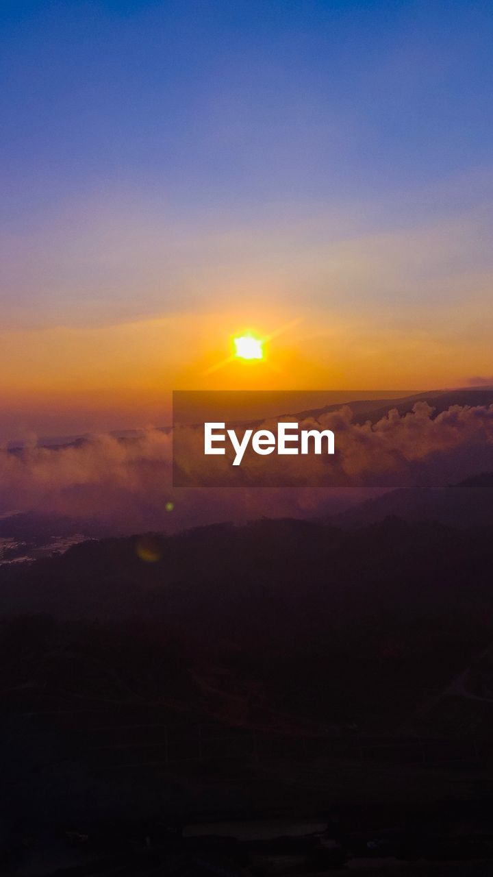 SCENIC VIEW OF SILHOUETTE LANDSCAPE AGAINST ROMANTIC SKY