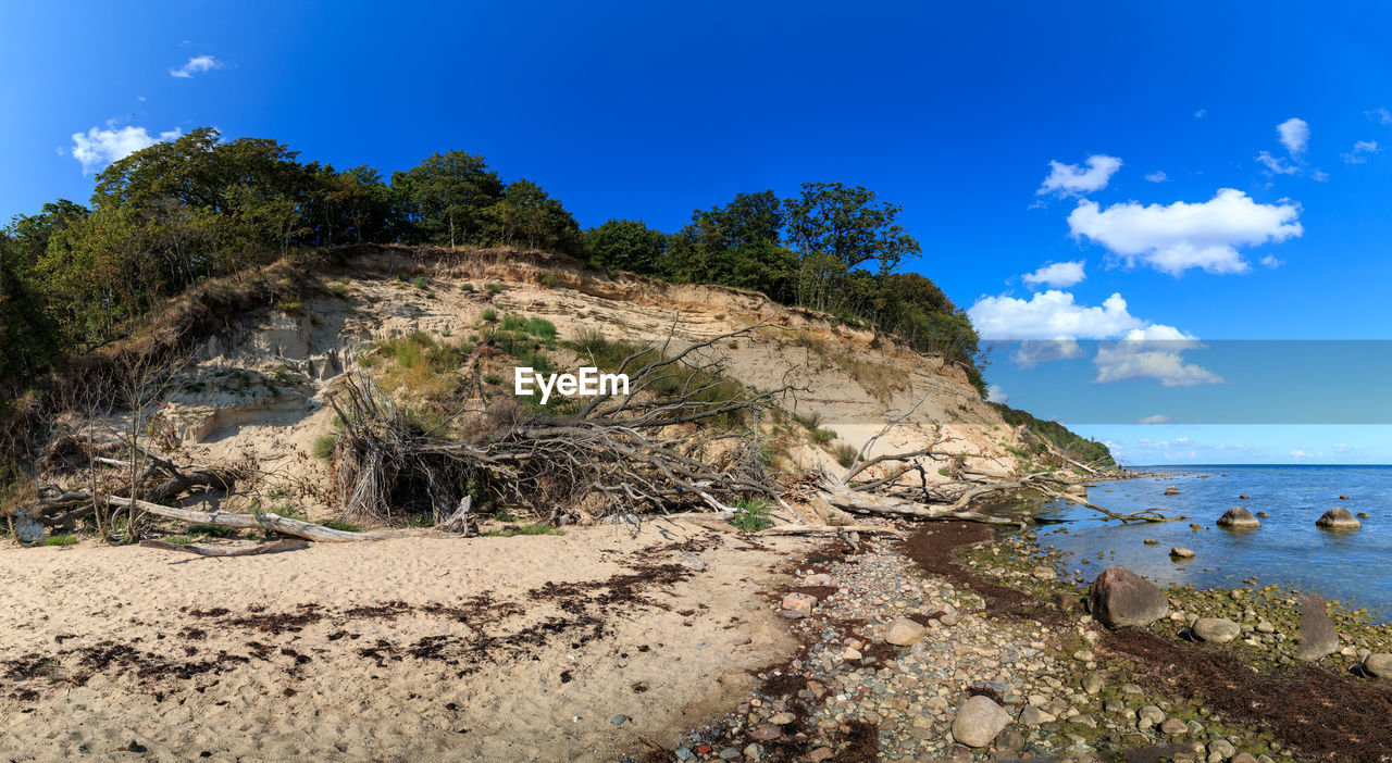 SCENIC VIEW OF BAY AGAINST SKY