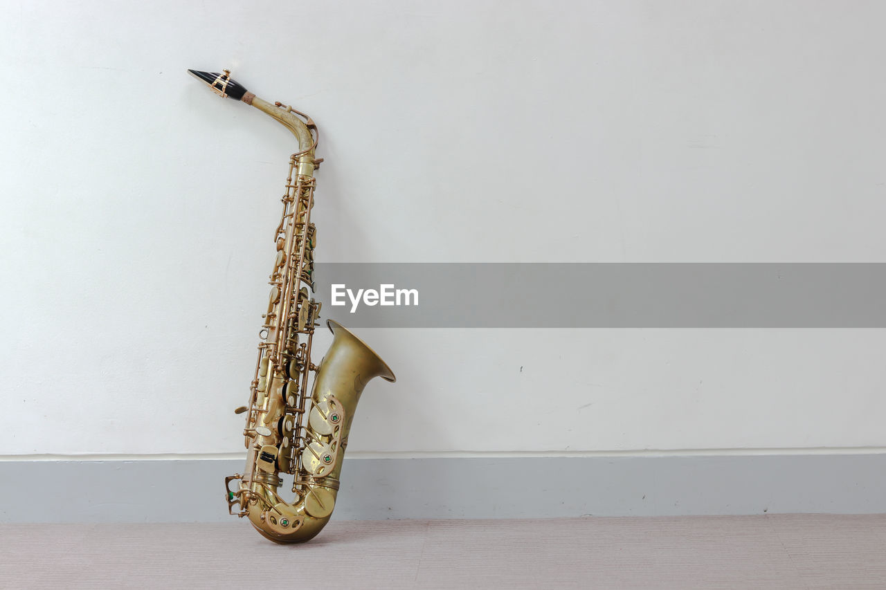 Saxophone against wall