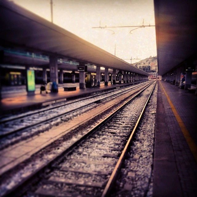 TRAIN ON RAILROAD STATION PLATFORM