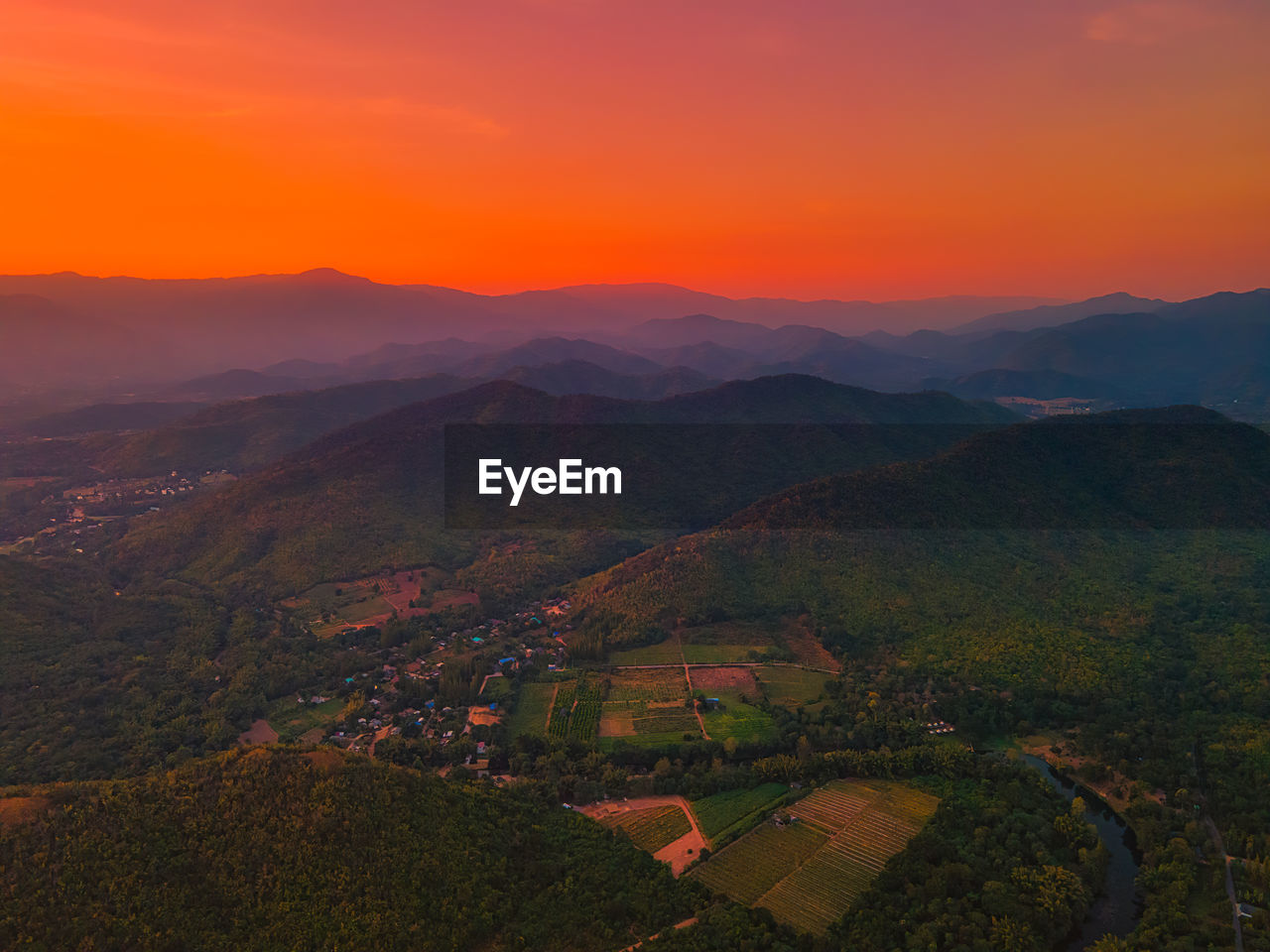 Scenic view of landscape of beautiful mountains against sky during sunset