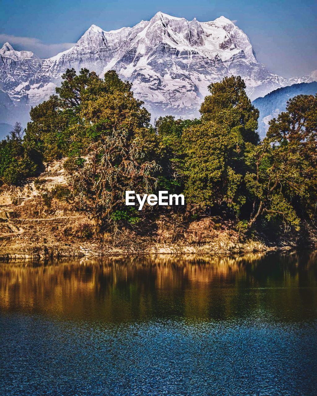 Scenic view of snowcapped mountains and lake against sky