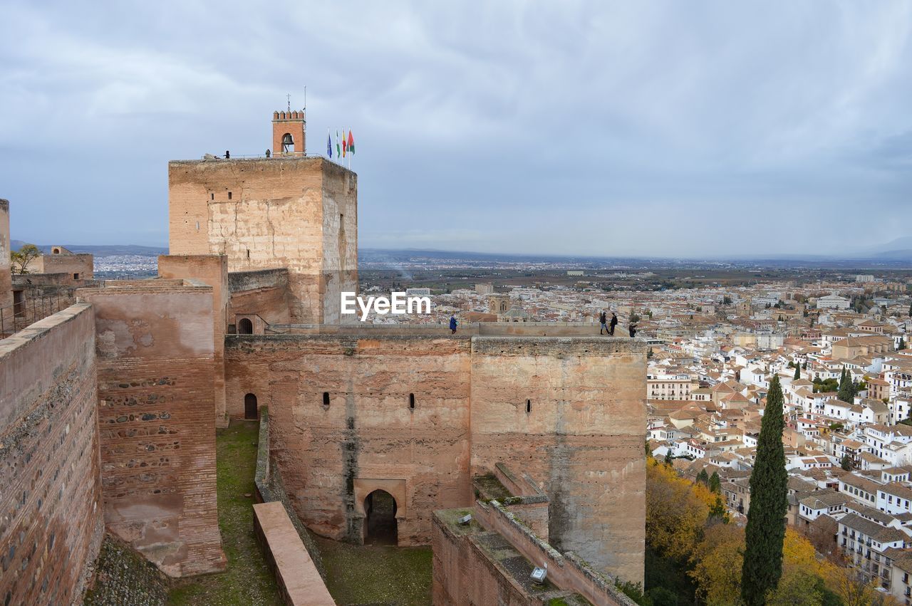 Historic building by sea against sky. alhambra. granada, spain.