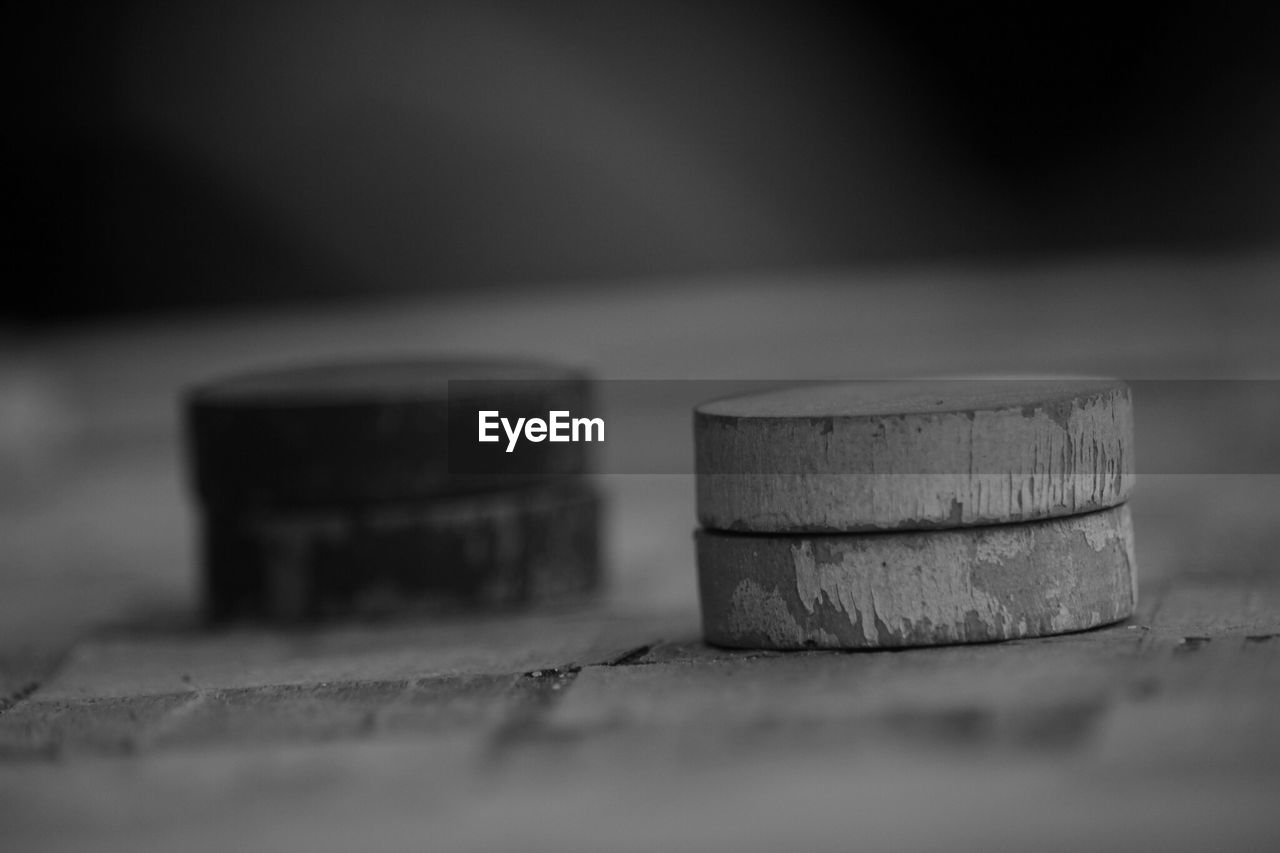 CLOSE-UP OF OLD STACK OF TABLE