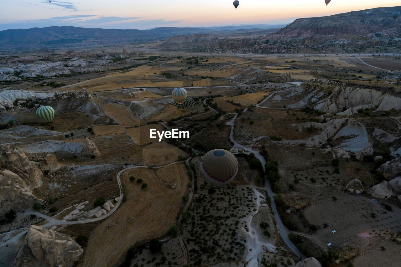 Aerial wide angle panoramic view  hot air balloons flying over cappadocia, central anatolia, turkey