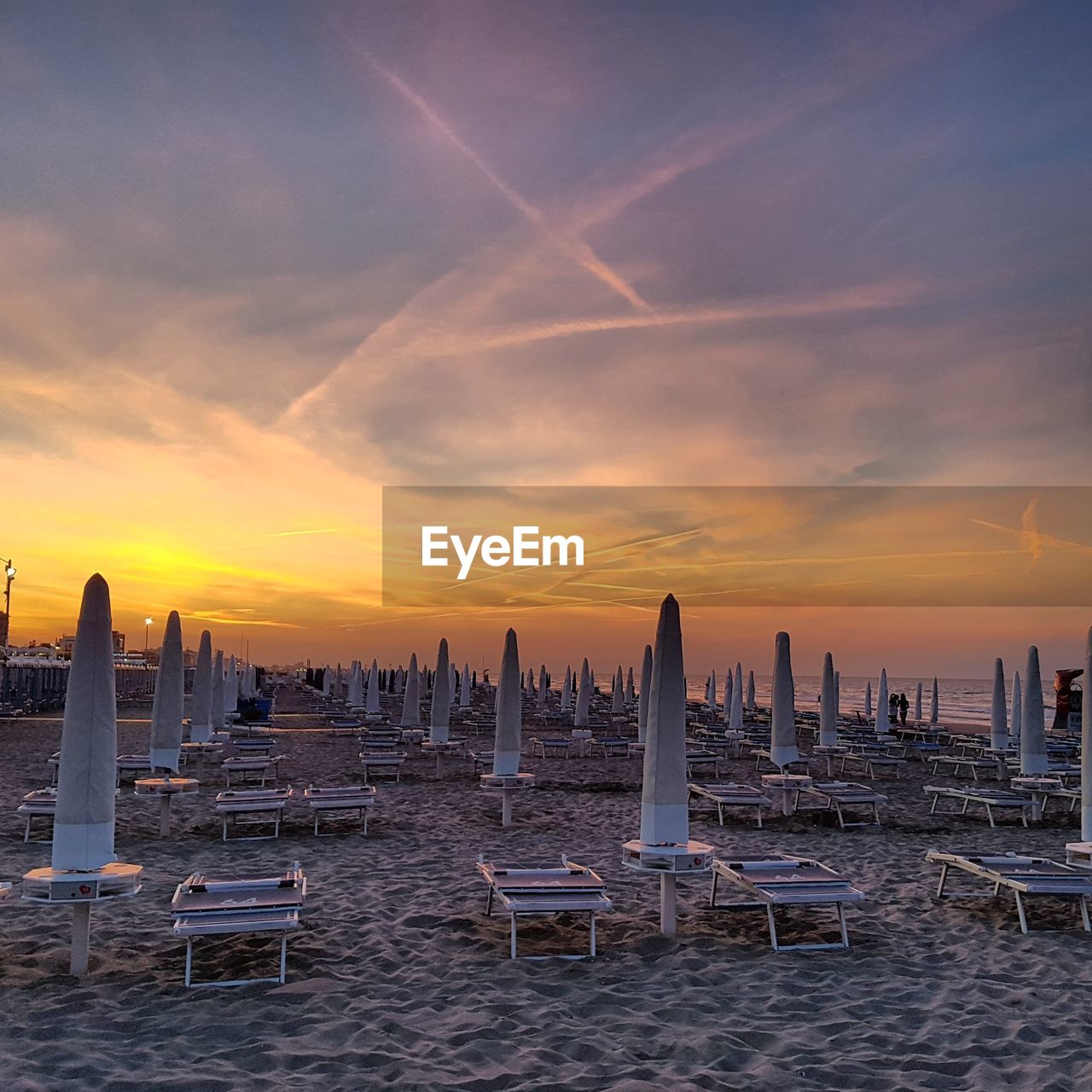 Scenic view of beach against sky during sunset