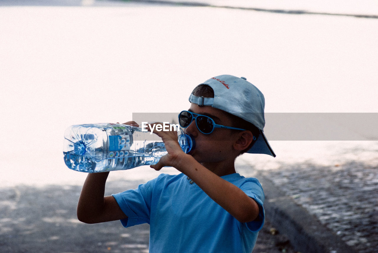 Boy drinking water from bottle