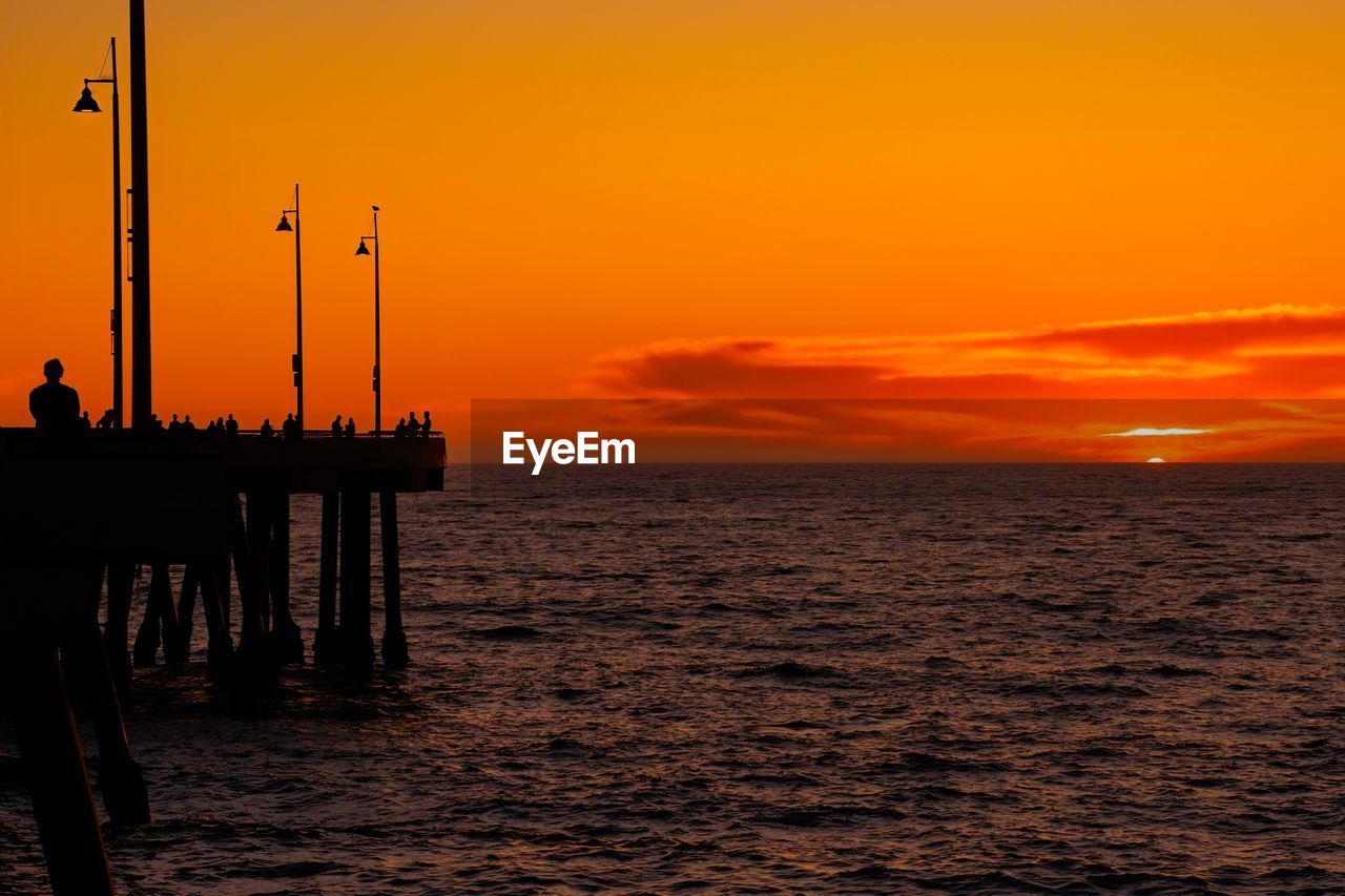 Scenic view of venice pier with orange sunset