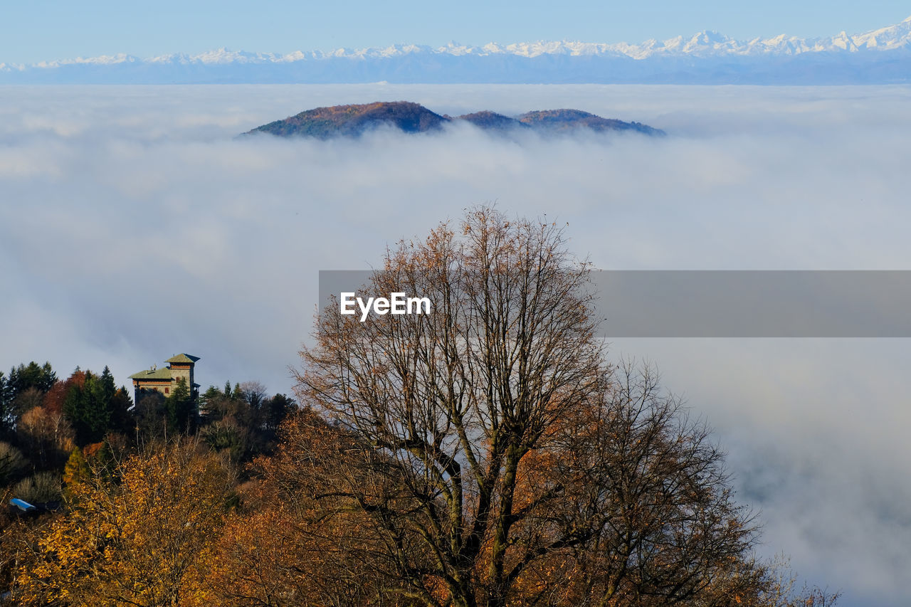 A sea of fog over the city of como and lake como, from a panoramic viewpoint in brunate.