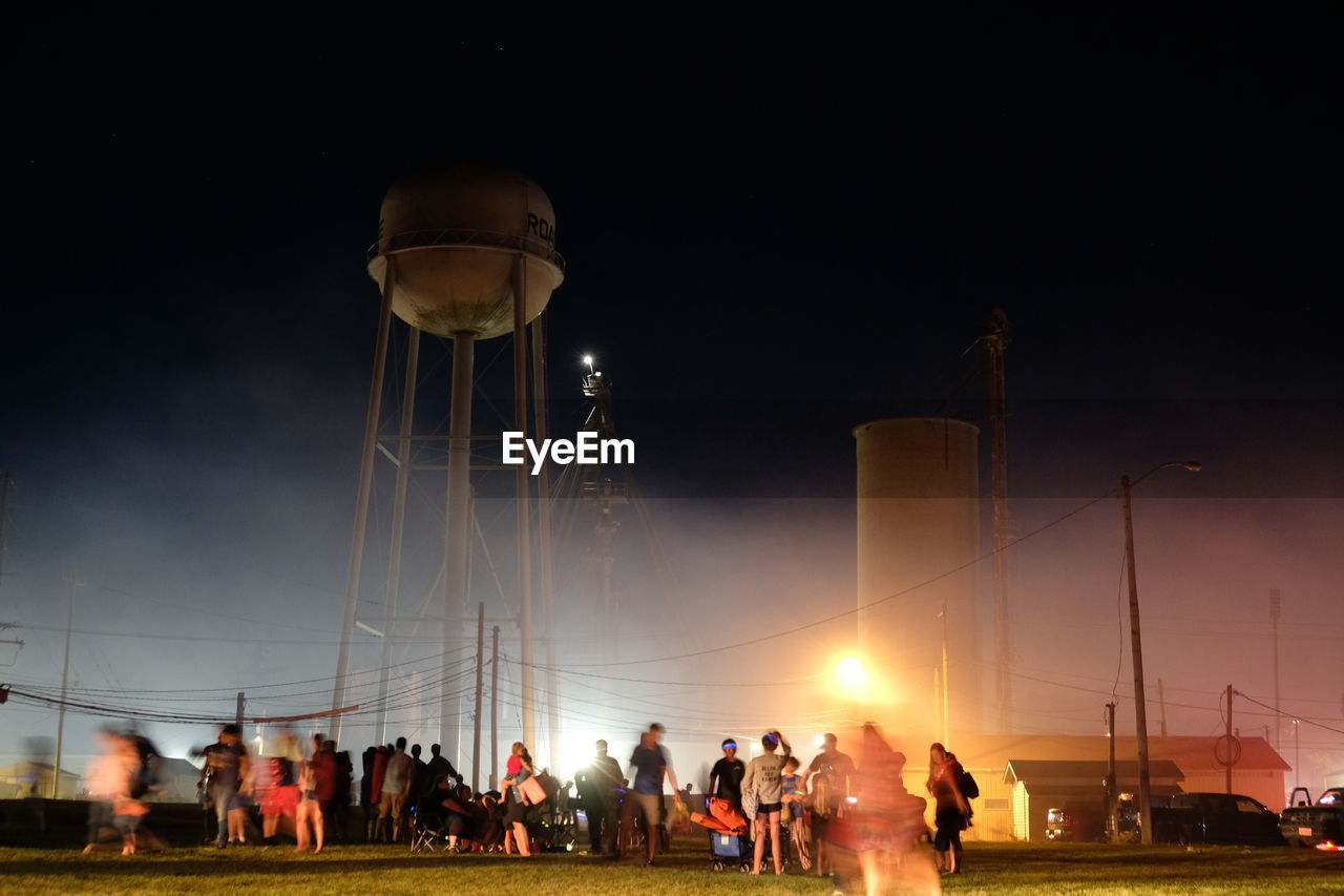 night, group of people, crowd, lighting, large group of people, sky, evening, light, nature, architecture, sports, men, outdoors, street light, person