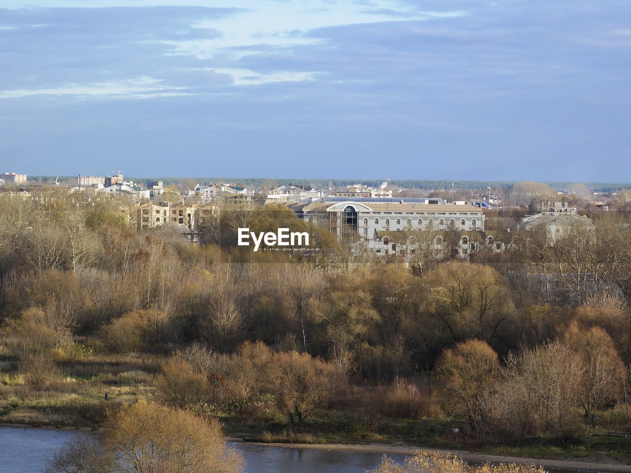 SCENIC VIEW OF LAKE AND CITY AGAINST SKY