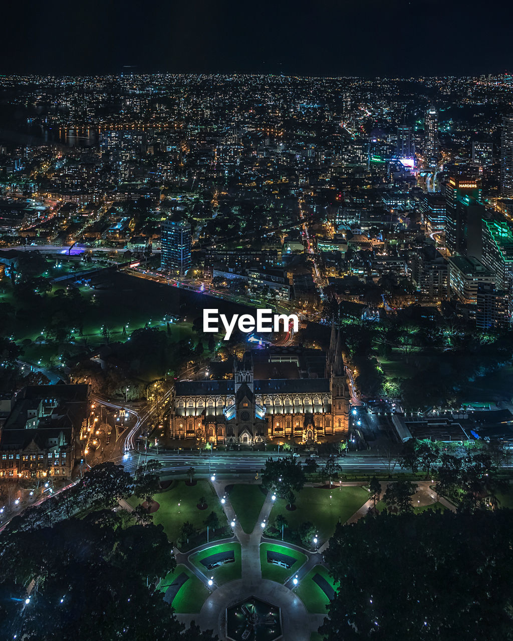 High angle view of illuminated buildings in city at night