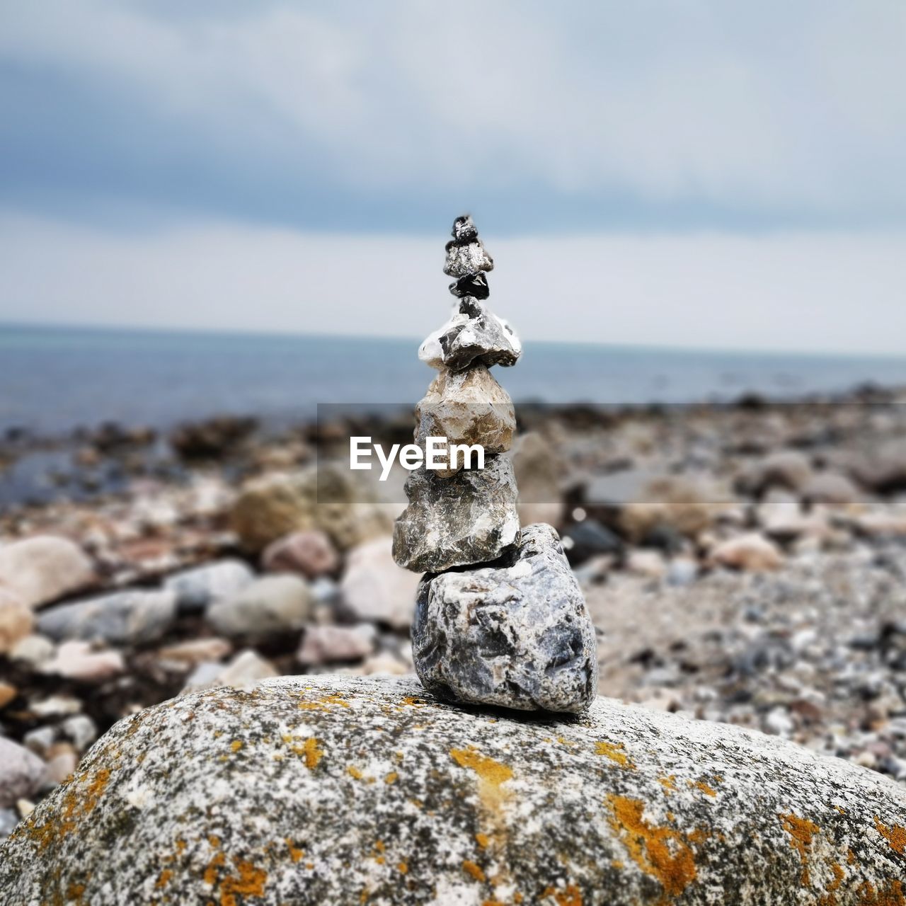 STACK OF STONES ON ROCK AT BEACH