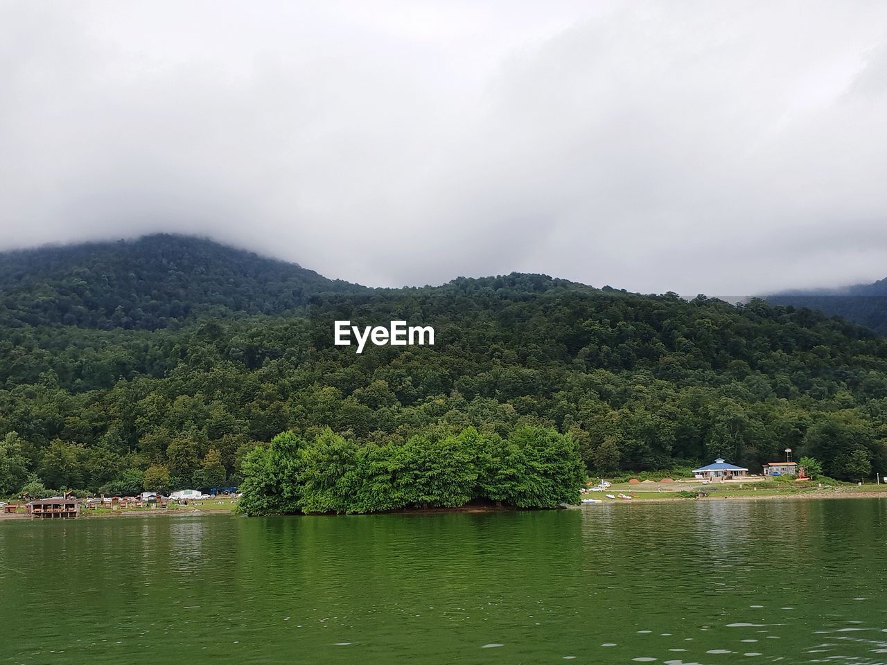 SCENIC VIEW OF RIVER BY TREE MOUNTAINS AGAINST SKY