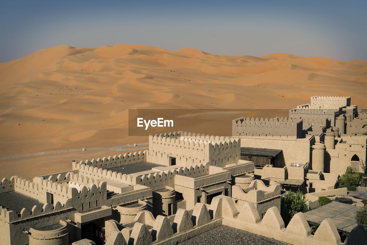 High angle view of city in desert against clear sky