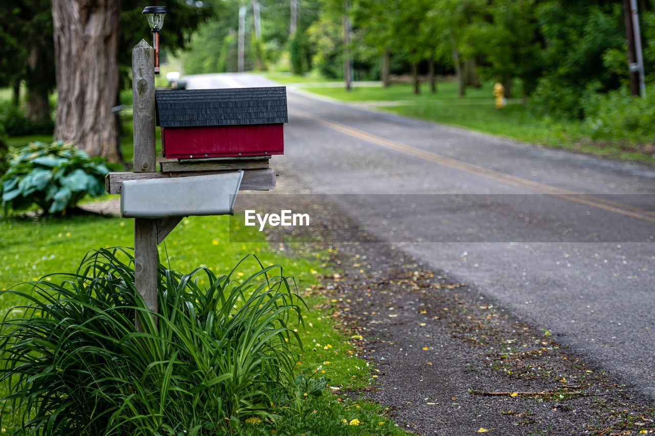 A traditional american mailbox on the side of a village road