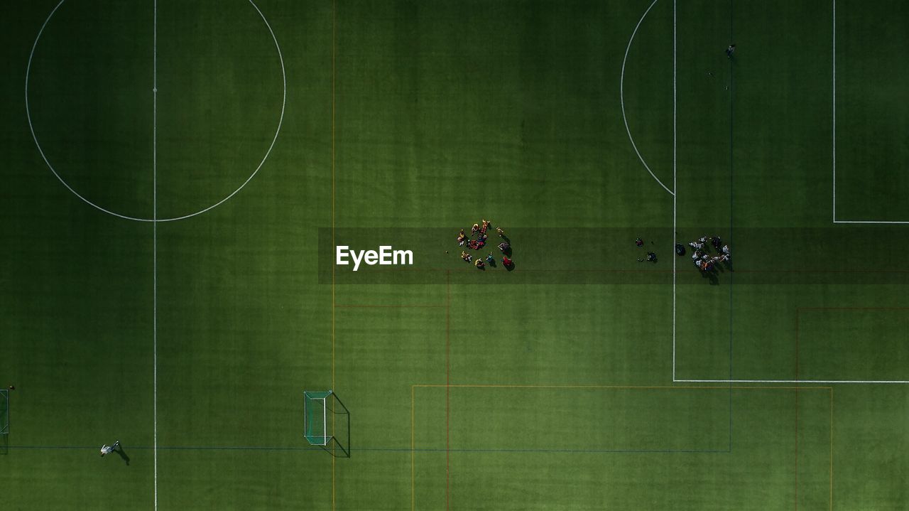 Directly above shot of people playing soccer on field