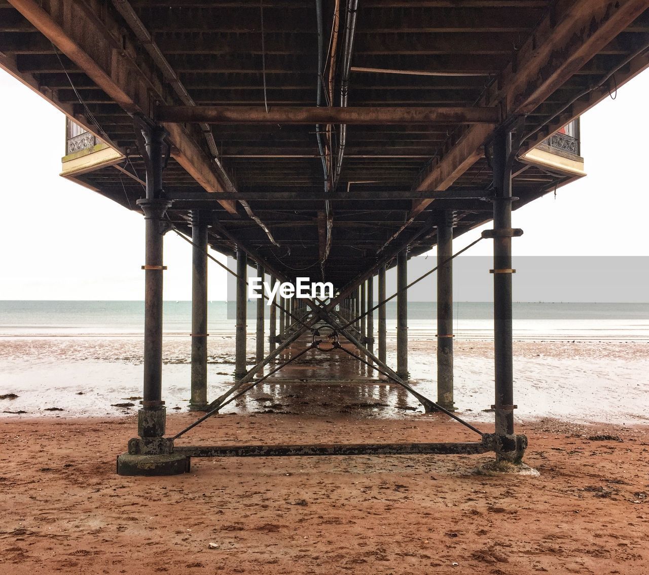 Pier over sea against sky