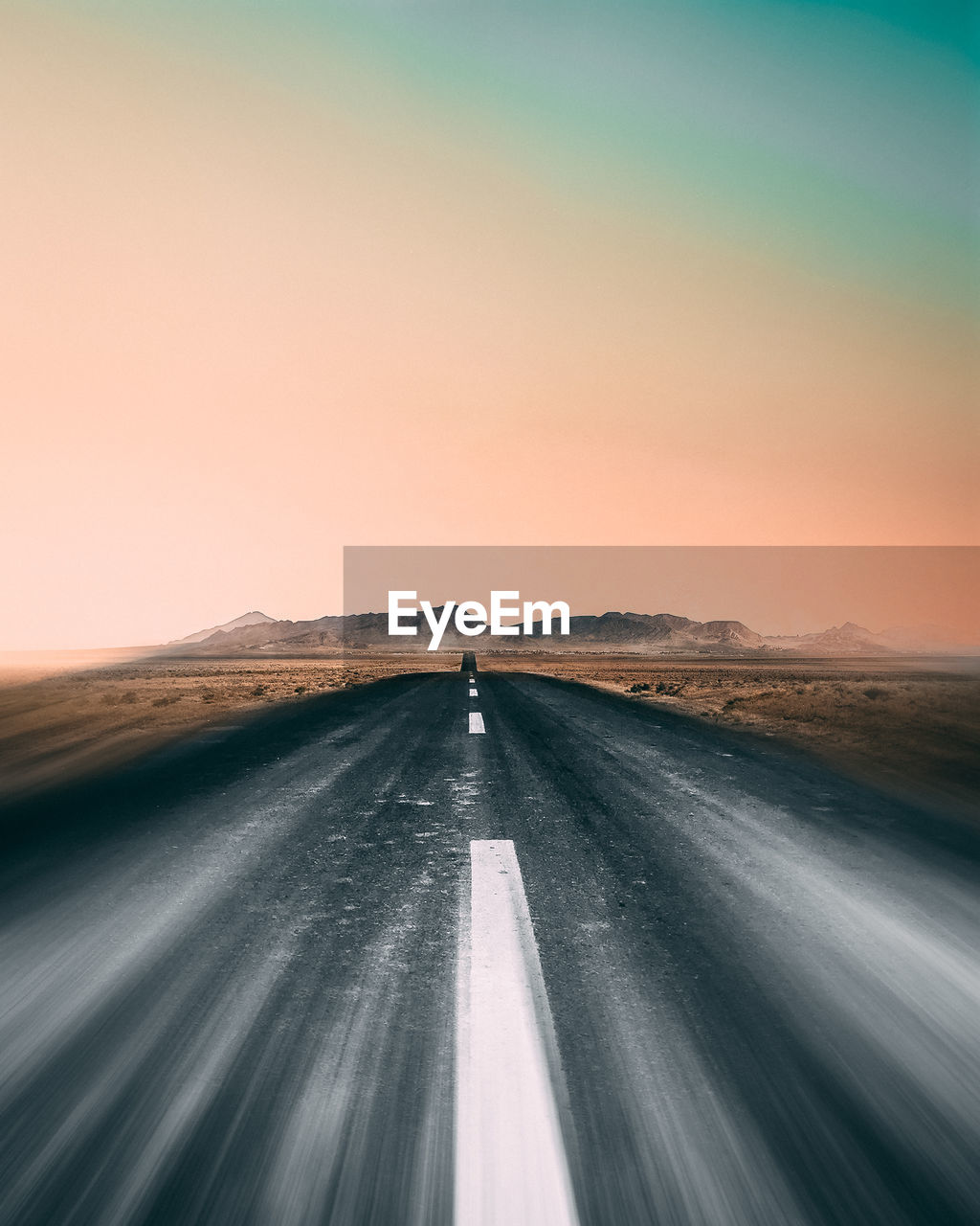 Road amidst landscape against clear sky