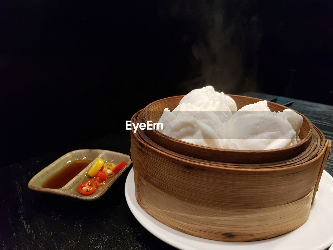 CLOSE-UP OF ICE CREAM ON TABLE