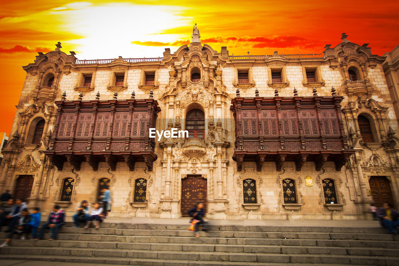 Low angle view of historic building against sky during sunset