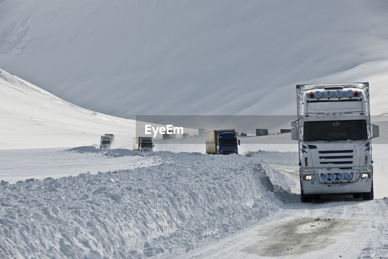 Trucks driving on the snow-covered no 1 road in iceland