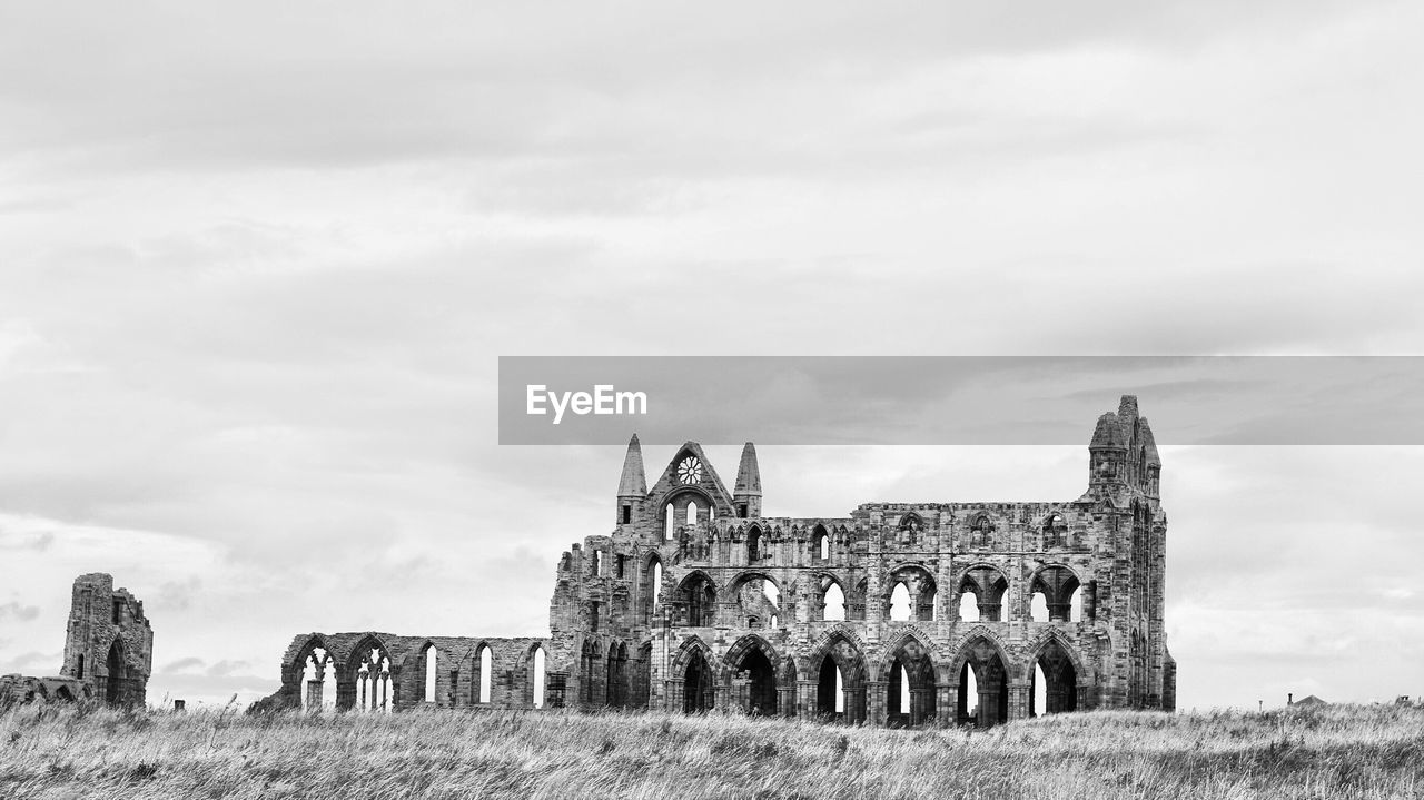 Old ruin building against cloudy sky