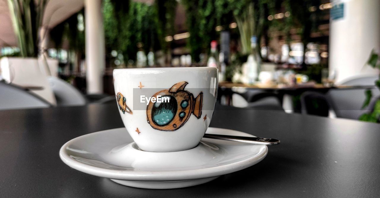 CLOSE-UP OF COFFEE ON TABLE