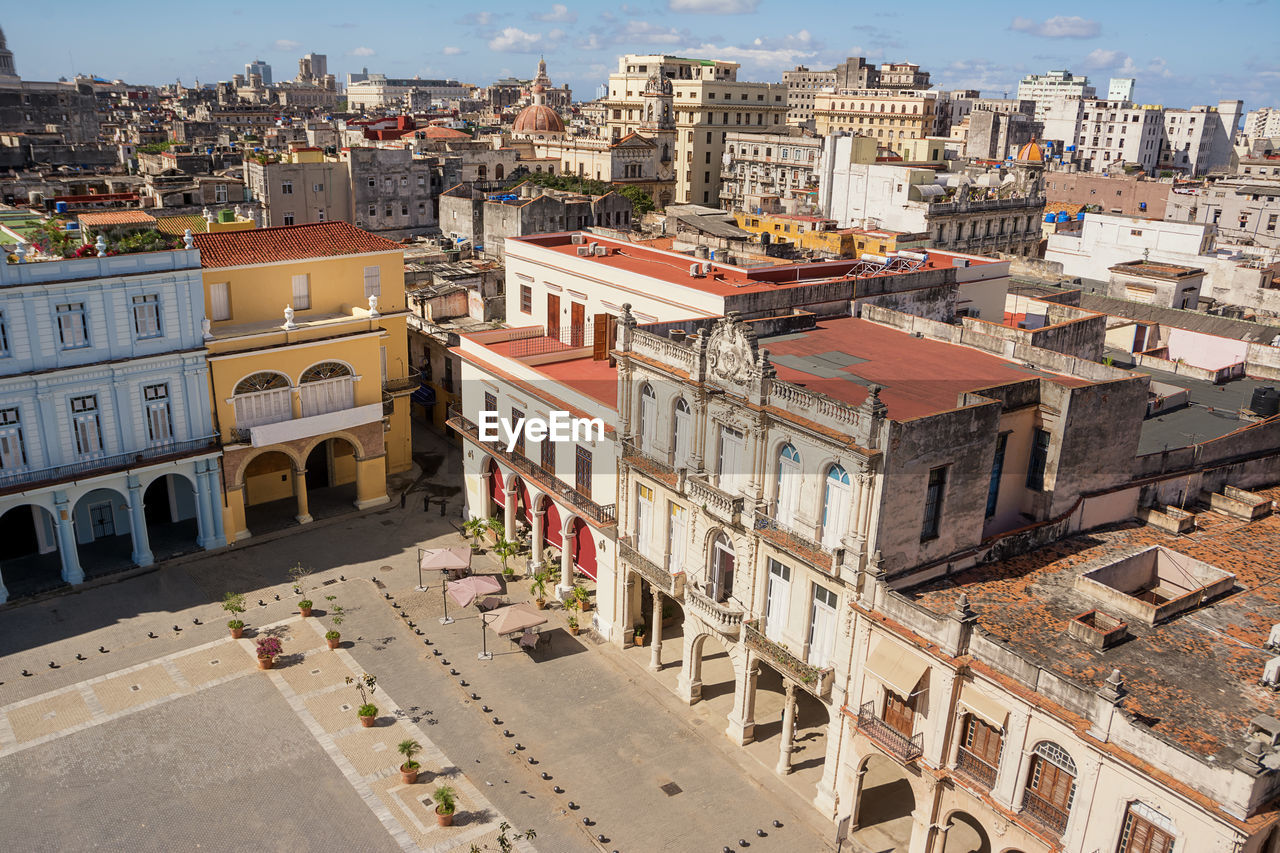 High angle view of buildings in city against sky