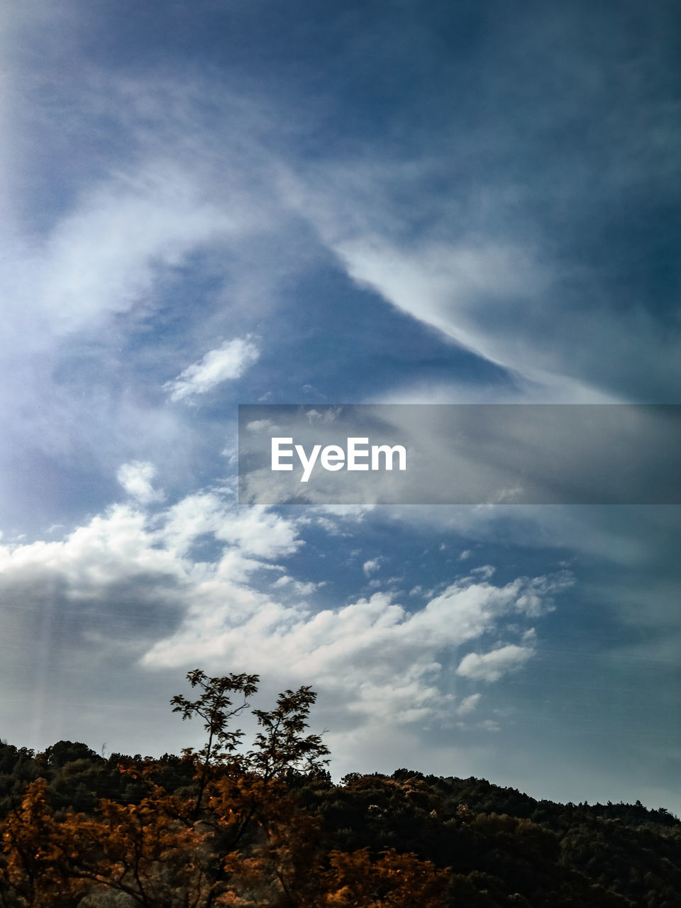 sky, cloud, tree, beauty in nature, nature, horizon, environment, scenics - nature, plant, no people, sunlight, landscape, dusk, tranquility, outdoors, mountain, blue, low angle view, cloudscape, land, tranquil scene, day, dramatic sky, non-urban scene, forest, rock