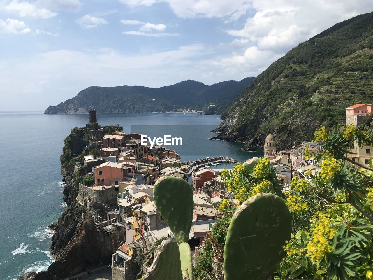 High angle view of sea and buildings against sky