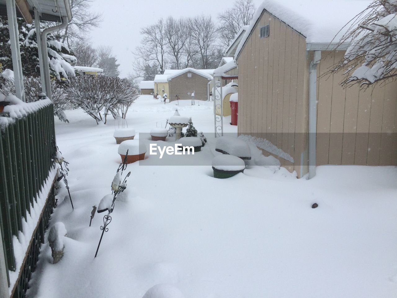 SNOW COVERED HOUSES BY BUILDING