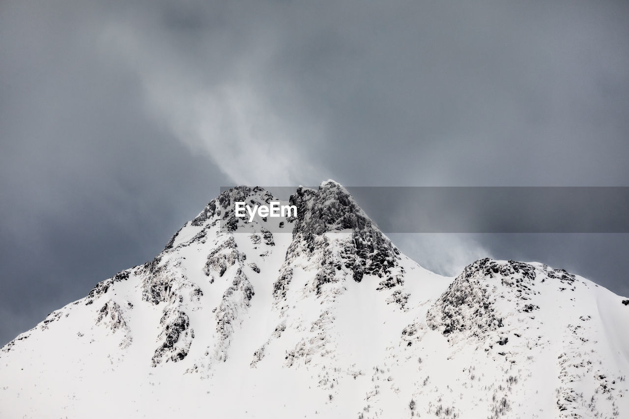 LOW ANGLE VIEW OF SNOWCAPPED MOUNTAINS AGAINST SKY DURING WINTER