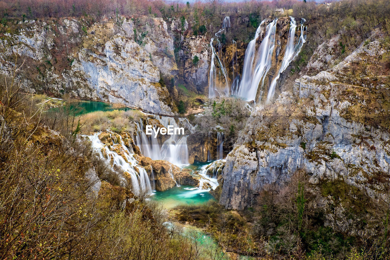 Scenic view of waterfall in forest. plitvice, croatia.