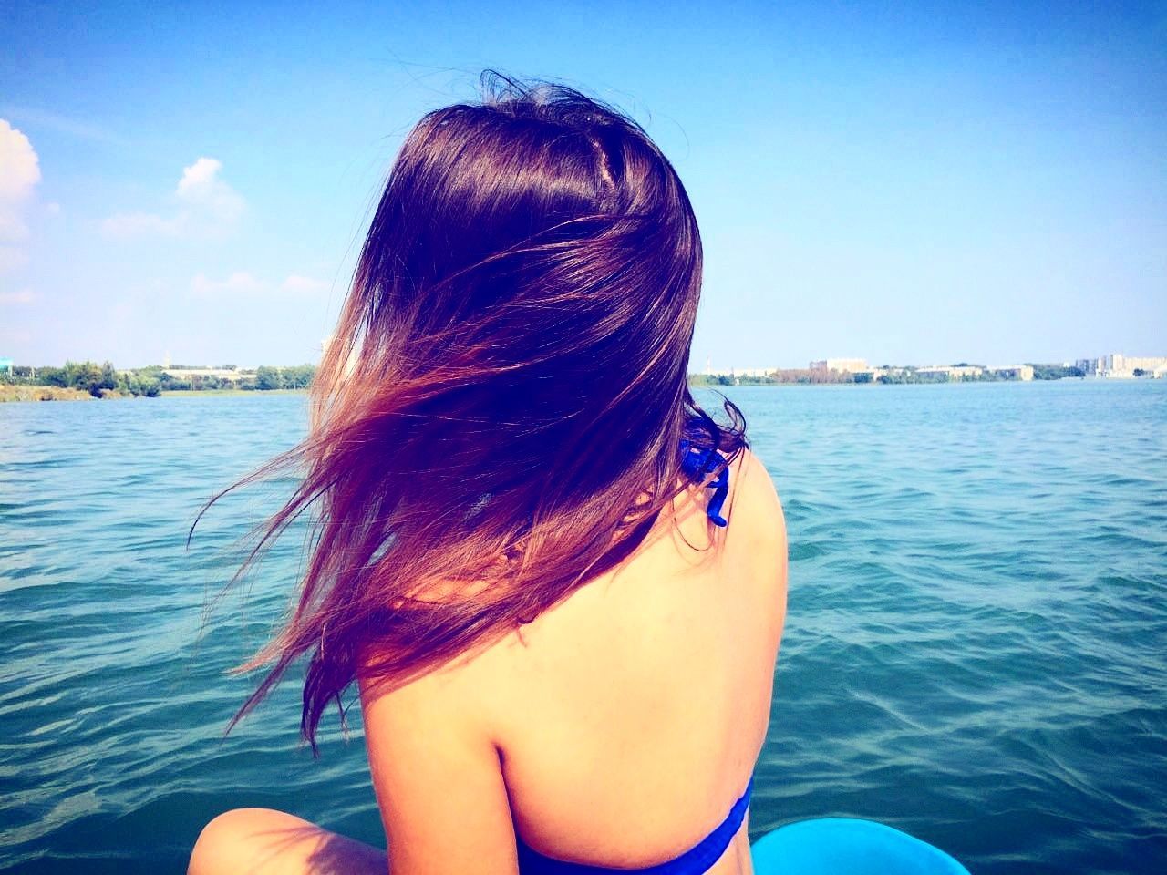 rear view, real people, water, sea, one person, leisure activity, lifestyles, sky, day, outdoors, nature, young women, women, young adult, nautical vessel, beauty in nature, close-up