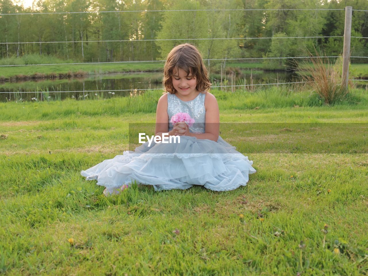 Girl sitting on field