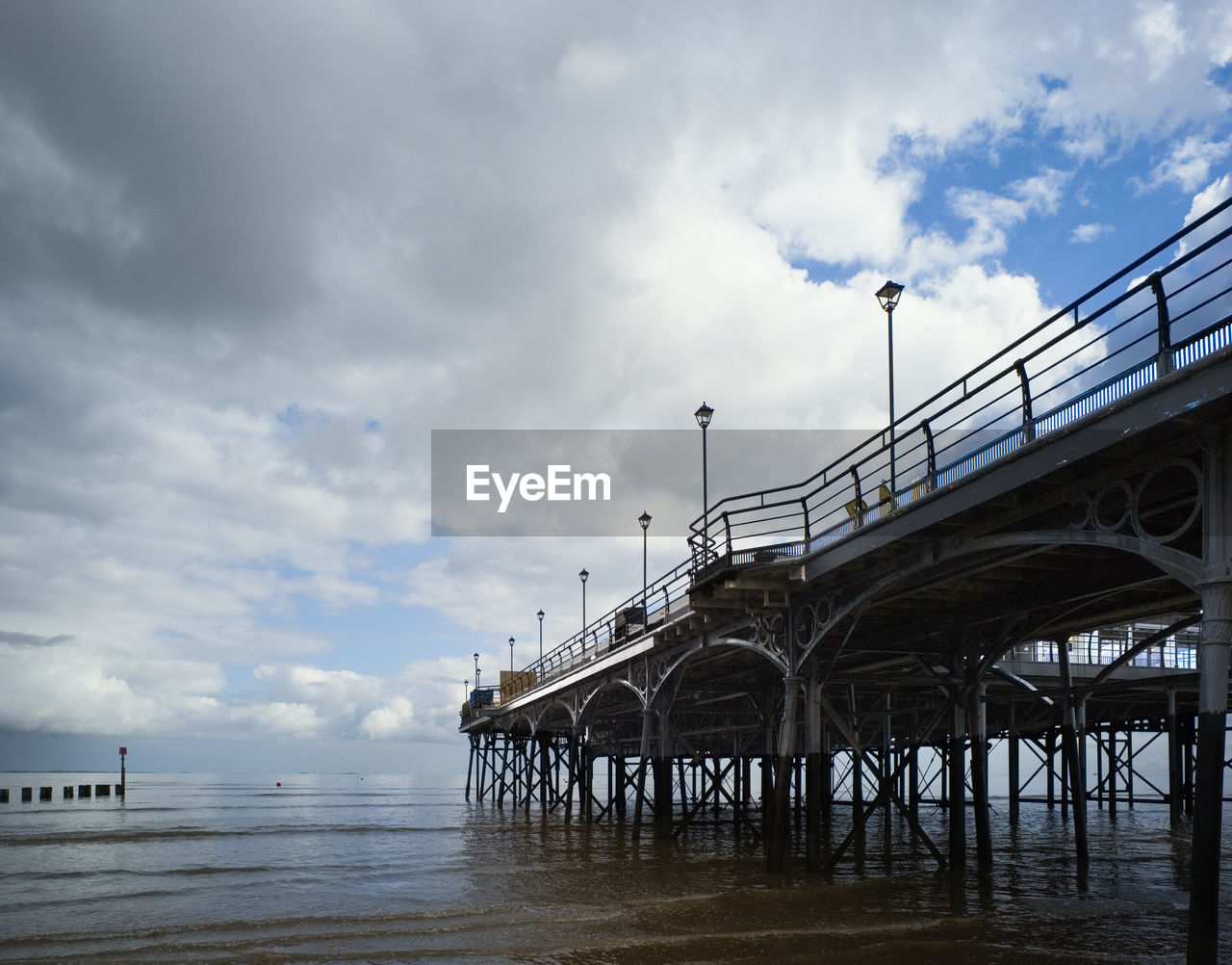 sky, cloud, water, pier, architecture, sea, built structure, nature, coast, ocean, beach, bridge, transportation, land, no people, outdoors, walkway, day, travel destinations, travel, beauty in nature, reflection, shore, boardwalk, scenics - nature, wave, environment, tranquility, tourism