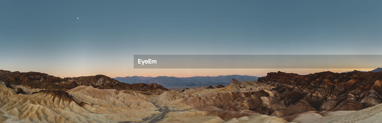 Before sunrise shot of the eroded landscape at Zabriskie Point, Death Valley, California, USA. Zabriskie Point Death Valley Death Valley National Park Amargosa Range Eroded Landscape Desert Vastness Eroded Rocks Moon Panorama High Resolution Sediments Iconic Iconic Landmark Iconic Landscape Texture Soft Colors  Sky Travel Travel Destinations Rock Formation Scenics Discover The World Places Around The World