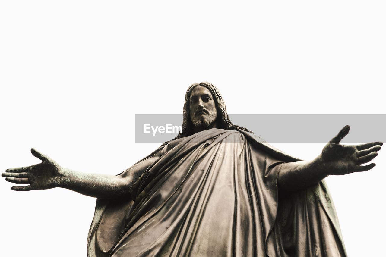 Low angle view of jesus christ statue against clear sky