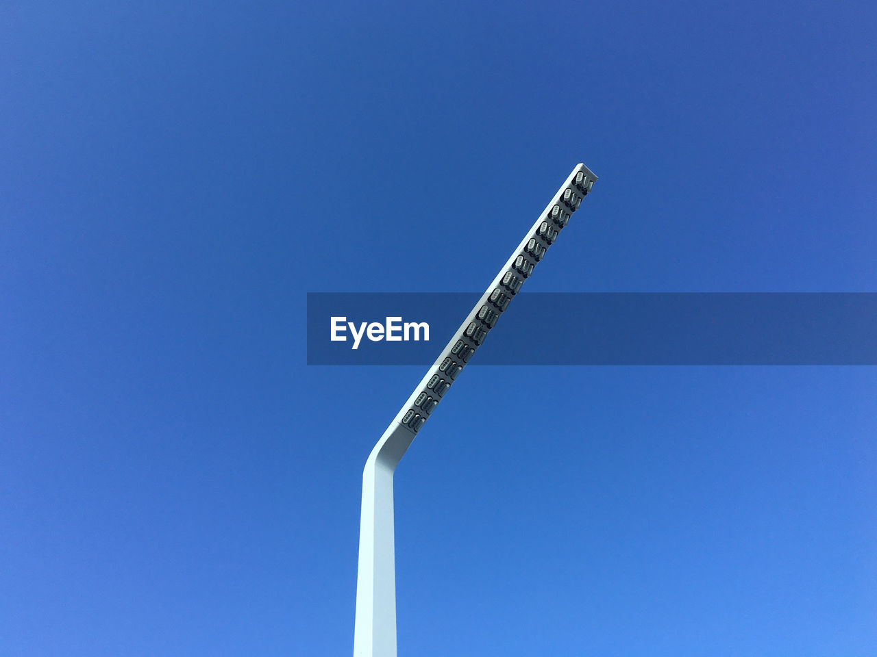 LOW ANGLE VIEW OF CRANE AGAINST CLEAR SKY