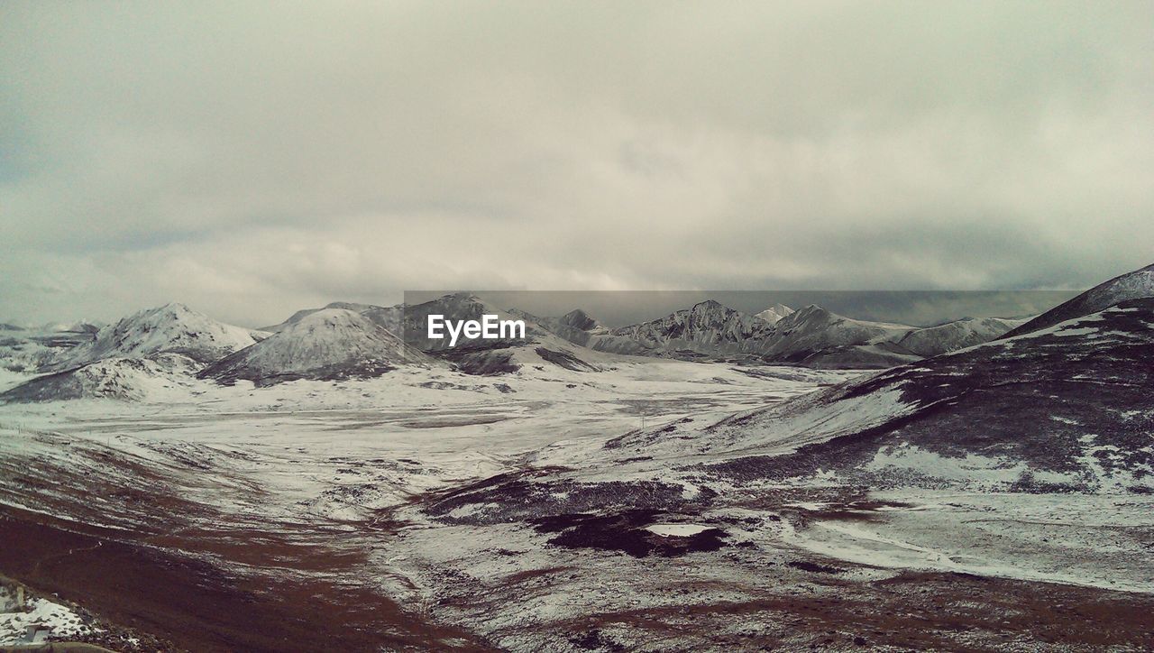 Scenic view of snow-covered mountains from tibet