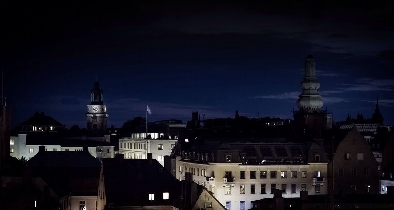 Illuminated buildings in city at night