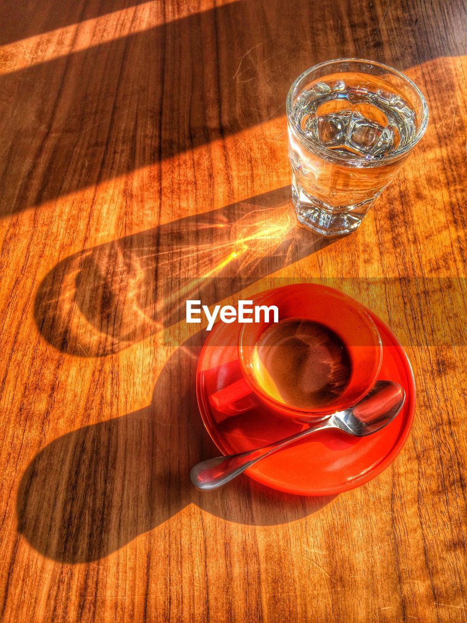 Close-up overhead view of coffee with glass of water