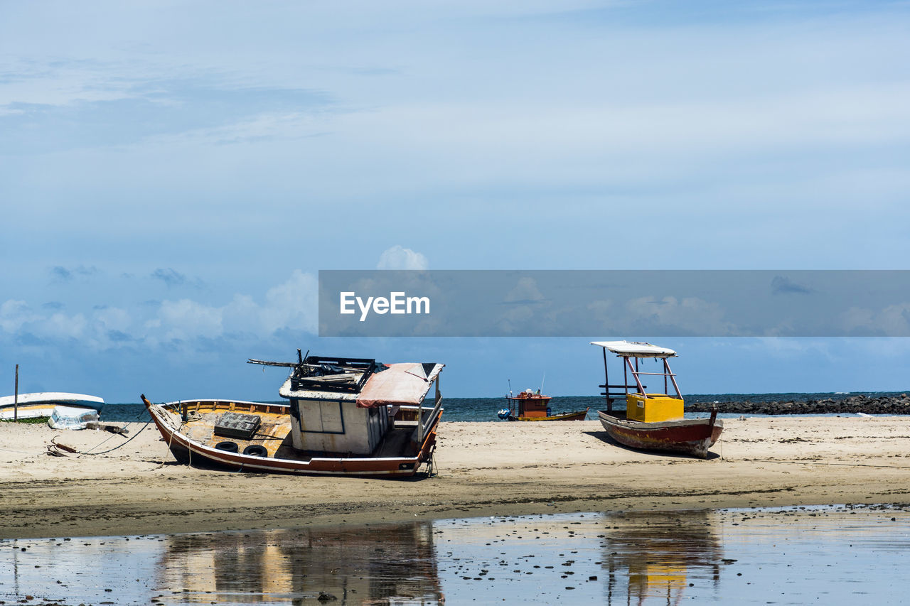 water, sea, shore, nautical vessel, transportation, mode of transportation, coast, sky, nature, boat, cloud, vehicle, moored, beach, day, ocean, bay, reflection, no people, land, ship, tranquility, outdoors, watercraft, beauty in nature, scenics - nature, travel, vacation, tranquil scene, body of water, fishing industry, non-urban scene